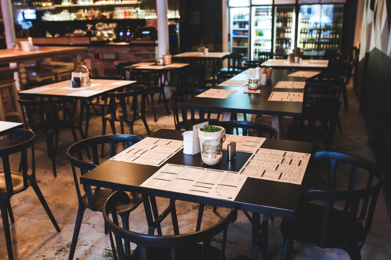 A restaurant with tables and chairs in it
