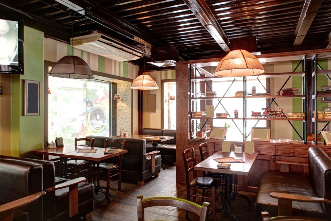 A restaurant with tables and chairs in it