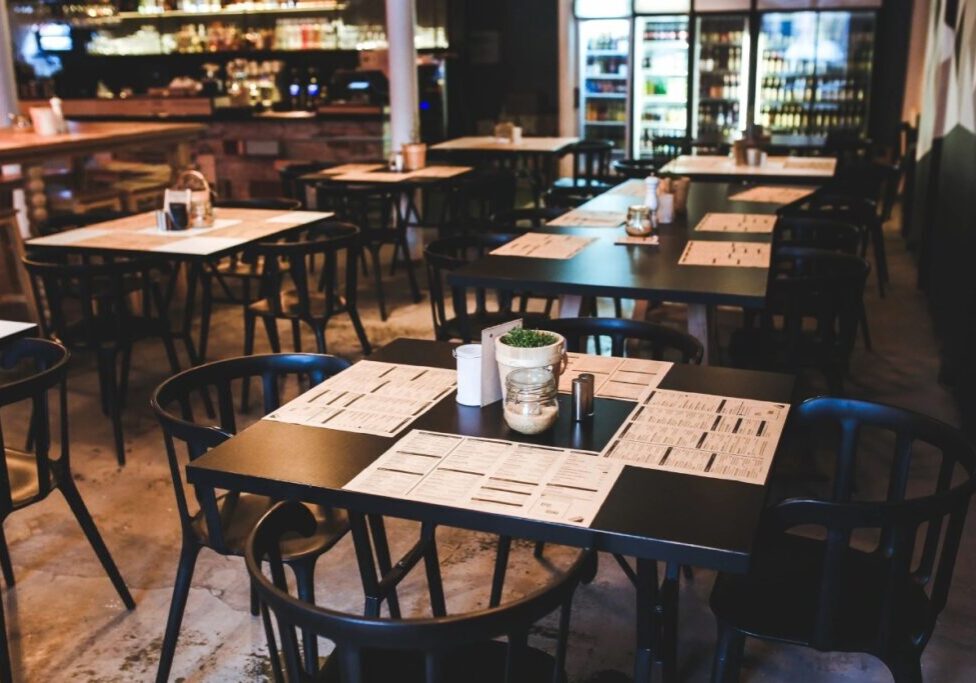 A restaurant with tables and chairs in it